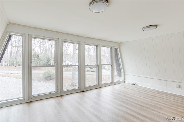 unfurnished sunroom featuring a wealth of natural light