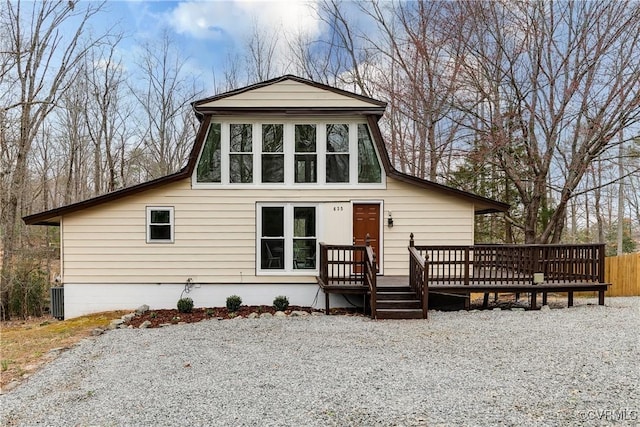 view of front of home featuring a wooden deck and central AC