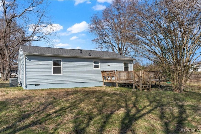 rear view of house with crawl space, central air condition unit, a yard, and a deck