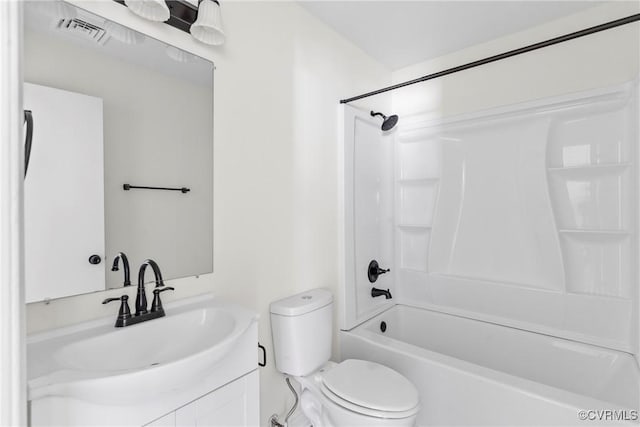 bathroom with visible vents, toilet,  shower combination, and vanity