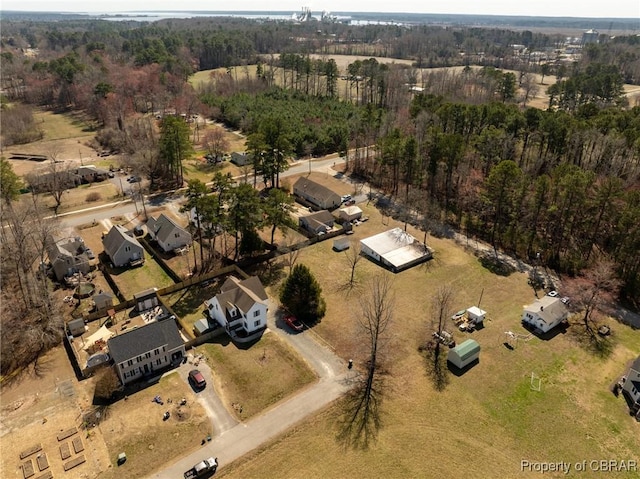 aerial view featuring a wooded view