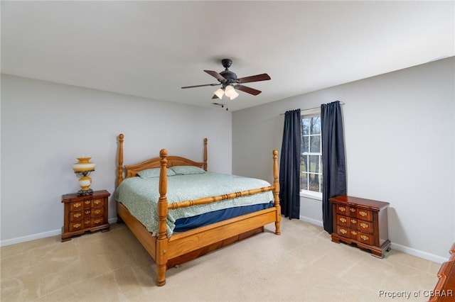 bedroom with baseboards, light colored carpet, and ceiling fan