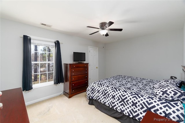 bedroom featuring visible vents, carpet flooring, baseboards, and ceiling fan