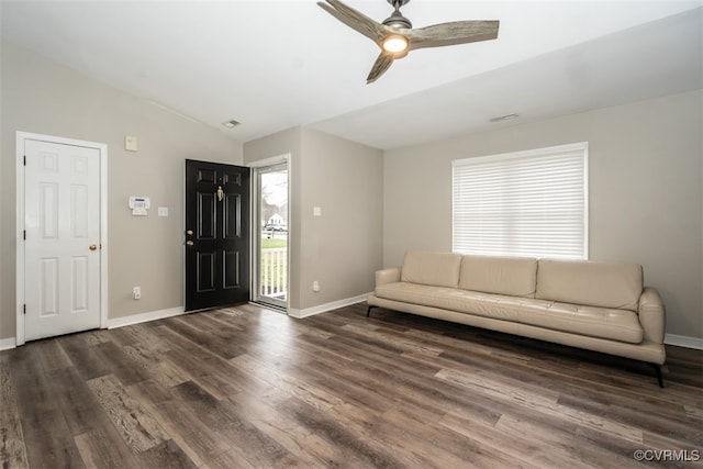 unfurnished living room with wood finished floors, visible vents, baseboards, ceiling fan, and vaulted ceiling