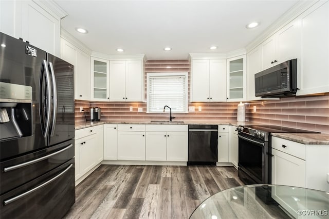 kitchen featuring range with electric cooktop, refrigerator with ice dispenser, a sink, white cabinetry, and dishwasher