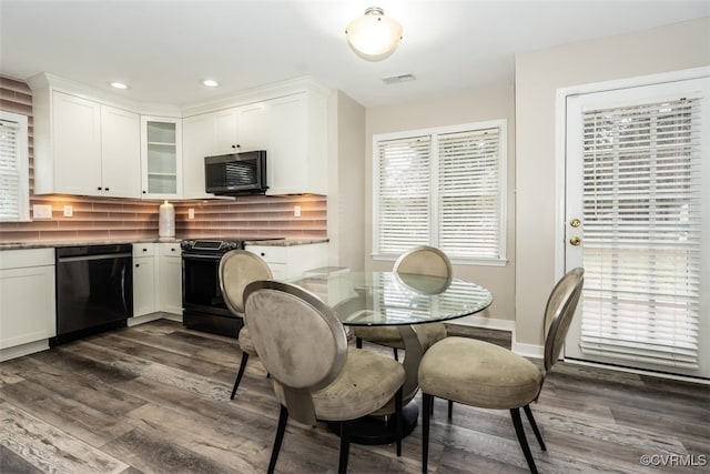 dining area featuring a wealth of natural light, recessed lighting, visible vents, and dark wood-style flooring