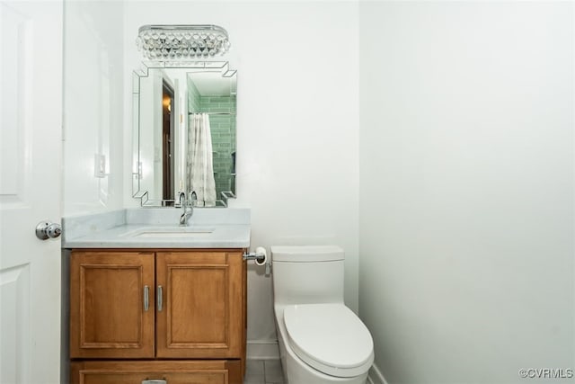 bathroom with toilet and vanity