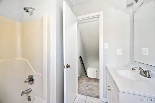 bathroom with tile patterned flooring, vanity, and washtub / shower combination