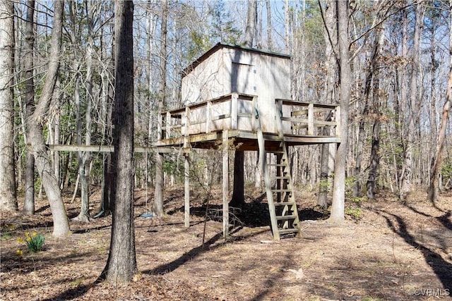 view of outdoor structure with a forest view