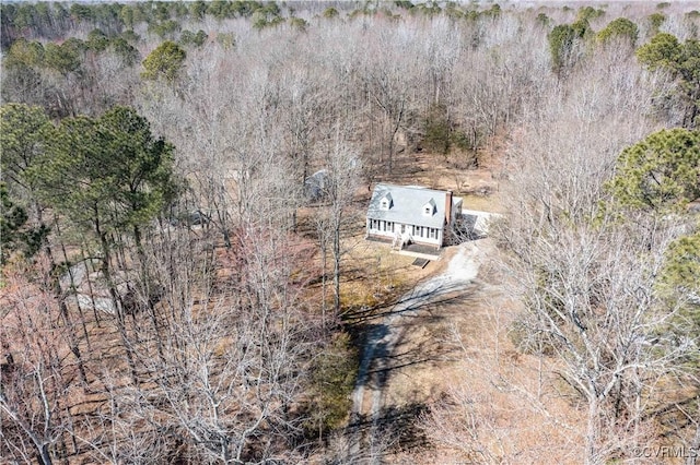 drone / aerial view featuring a forest view