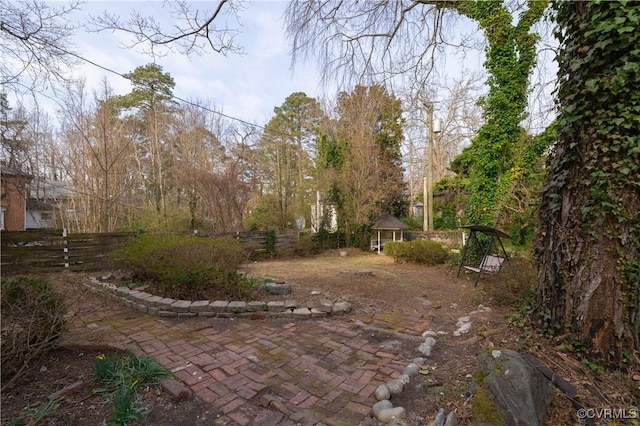 view of yard featuring a patio area and a fenced backyard