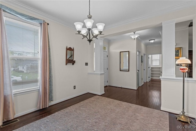 117 Giddy-Up Ln, Ashland, VA 23005 - unfurnished dining area with hardwood / wood-style floors, healthy amount of natural light, a chandelier, baseboards, and crown molding
