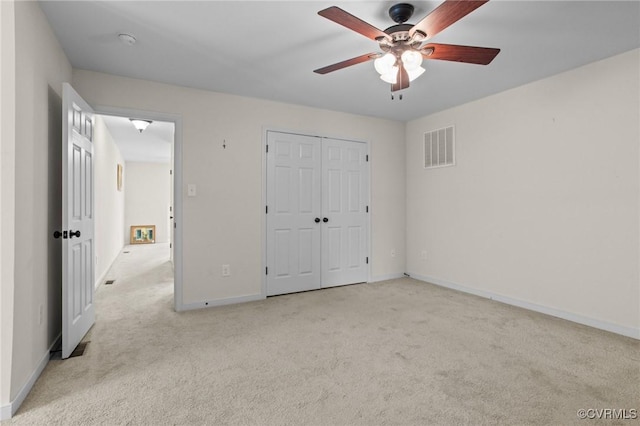 117 Giddy-Up Ln, Ashland, VA 23005 - unfurnished bedroom featuring carpet floors, baseboards, a closet, and a ceiling fan