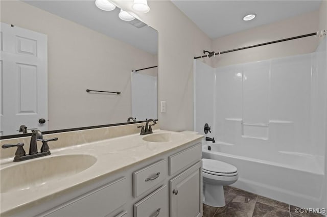 117 Giddy-Up Ln, Ashland, VA 23005 - full bathroom with toilet, double vanity, washtub / shower combination, and stone finish flooring