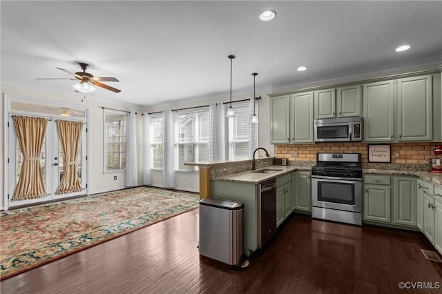 117 Giddy-Up Ln, Ashland, VA 23005 - kitchen featuring stainless steel appliances, a peninsula, a sink, dark wood-style floors, and backsplash