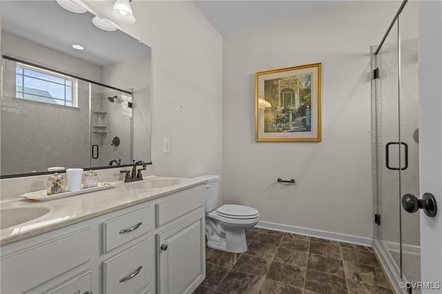 117 Giddy-Up Ln, Ashland, VA 23005 - bathroom with double vanity, a stall shower, toilet, and baseboards