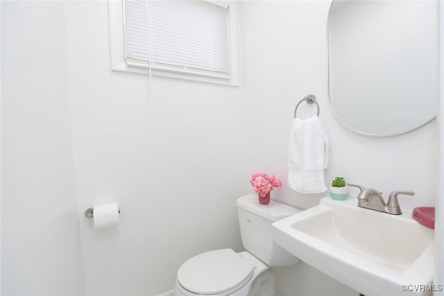 bathroom with a sink and toilet