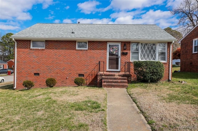 bungalow-style home with a front yard, crawl space, brick siding, and a shingled roof