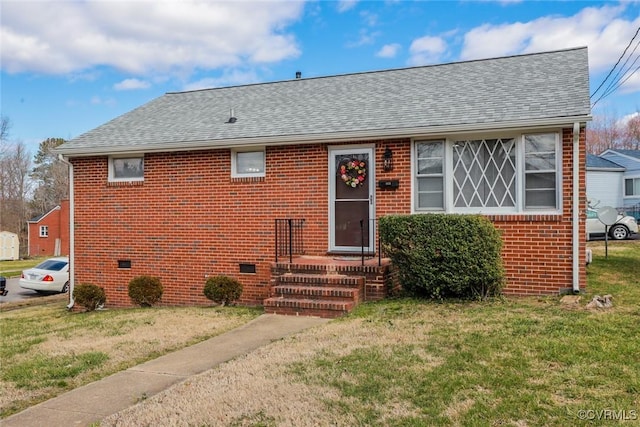 bungalow-style house with brick siding, a front yard, and a shingled roof