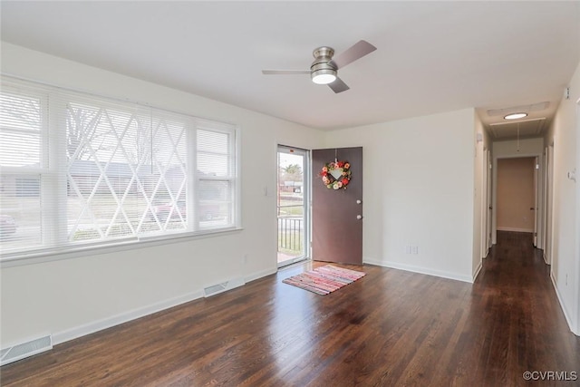 entryway with visible vents, baseboards, ceiling fan, and wood finished floors