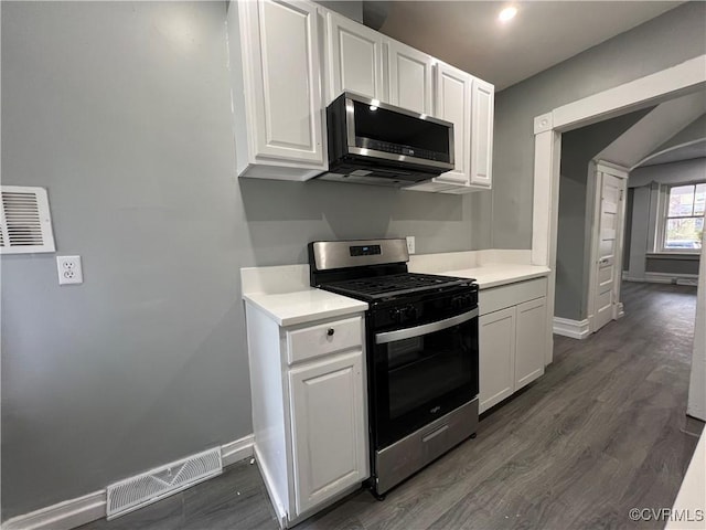 kitchen with white cabinetry, light countertops, visible vents, and appliances with stainless steel finishes