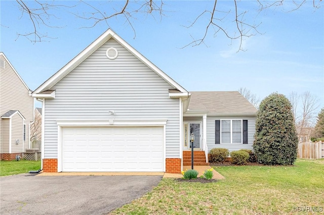 ranch-style home with a garage, driveway, a front lawn, and fence