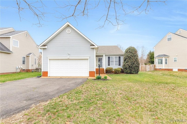 view of front facade with a garage, a front yard, driveway, and fence