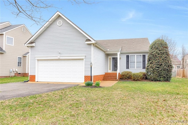 ranch-style home featuring driveway, an attached garage, a front yard, and fence