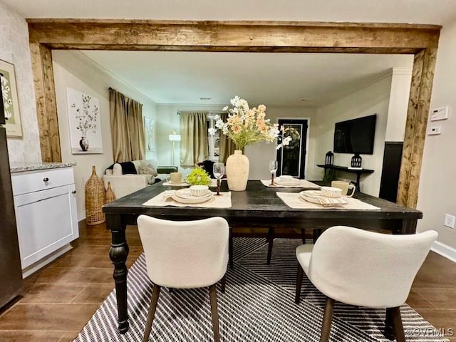 dining area featuring baseboards, dark wood-type flooring, and ornamental molding