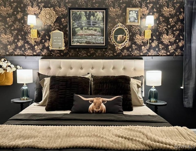 bedroom with wainscoting and wallpapered walls