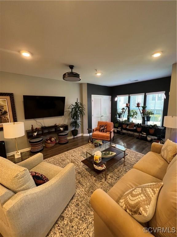 living room with recessed lighting, wood finished floors, and baseboards