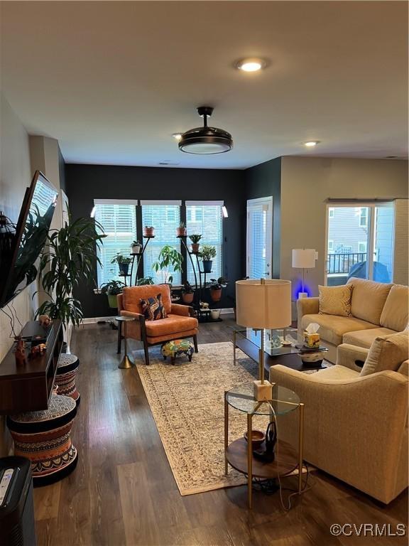 living room featuring dark wood-style flooring