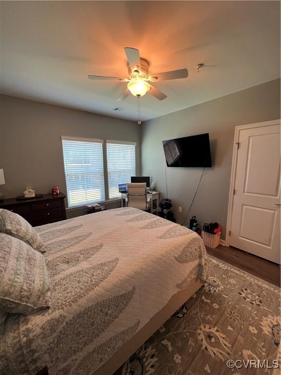 bedroom featuring ceiling fan and wood finished floors