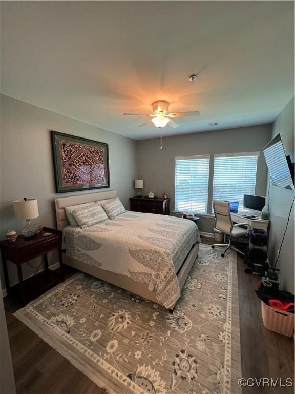 bedroom featuring a ceiling fan and wood finished floors