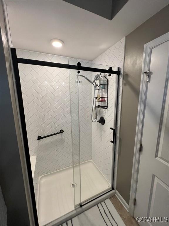 full bathroom with a shower stall