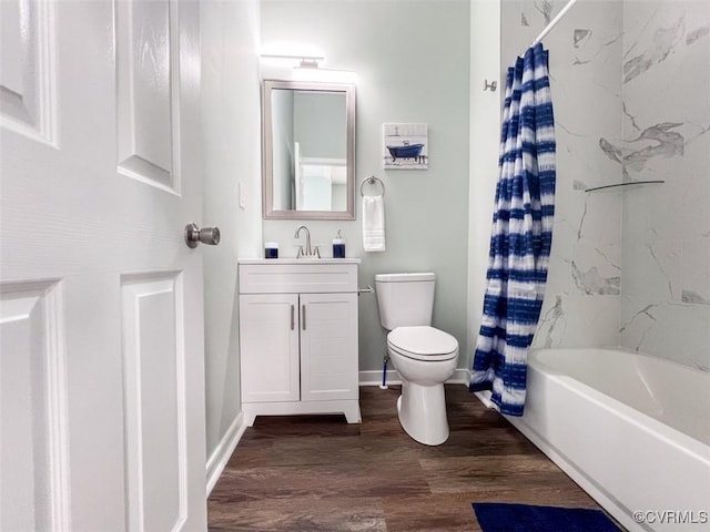 bathroom featuring shower / bath combo with shower curtain, toilet, wood finished floors, baseboards, and vanity