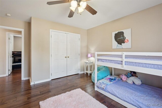 bedroom featuring baseboards, a closet, and wood finished floors