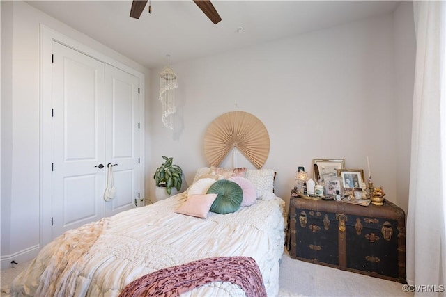 bedroom featuring a closet, carpet, and a ceiling fan