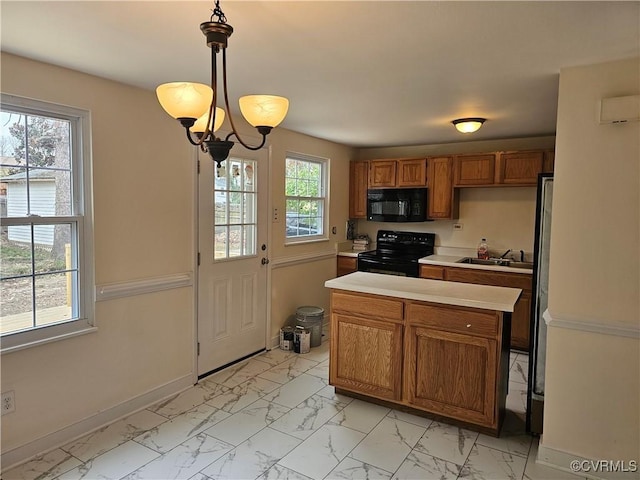 kitchen with light countertops, brown cabinets, marble finish floor, black appliances, and a sink