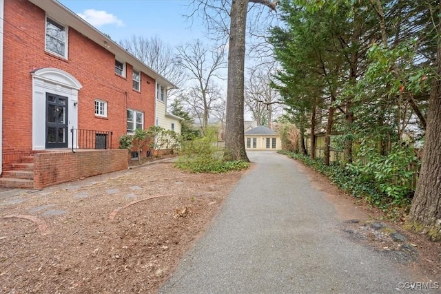 exterior space featuring brick siding