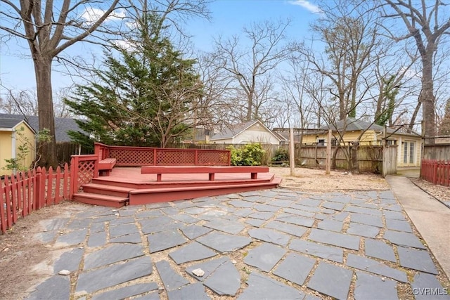 view of patio / terrace with a fenced backyard and a wooden deck