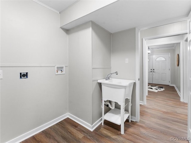 clothes washing area featuring baseboards, laundry area, hookup for a washing machine, wood finished floors, and electric dryer hookup