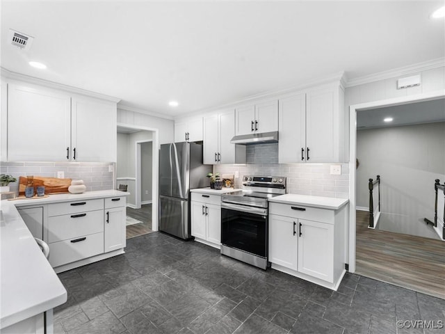 kitchen featuring visible vents, under cabinet range hood, light countertops, white cabinets, and stainless steel appliances