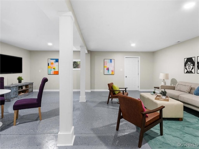 living room with recessed lighting, speckled floor, and baseboards