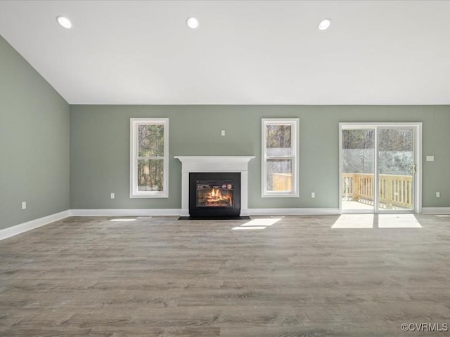 0 Silver Trail Cir, Lawrenceville, VA 23868 - unfurnished living room with a fireplace with flush hearth, baseboards, wood finished floors, and recessed lighting