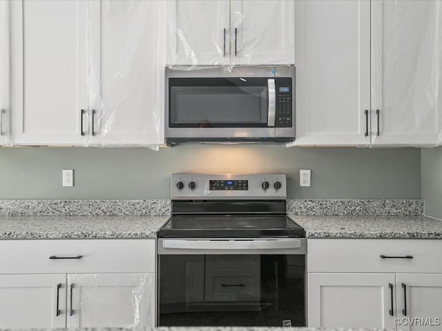 0 Silver Trail Cir, Lawrenceville, VA 23868 - kitchen featuring appliances with stainless steel finishes, white cabinetry, and light stone countertops