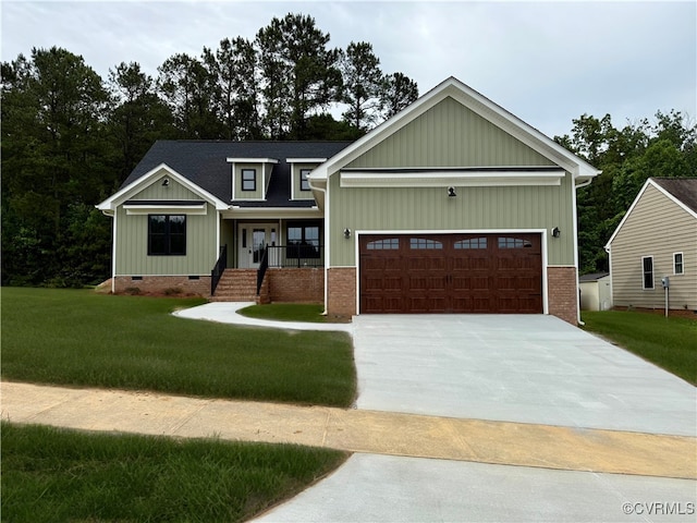 0 Silver Trail Cir, Lawrenceville, VA 23868 - view of front of property featuring a front lawn, concrete driveway, a garage, and a shingled roof