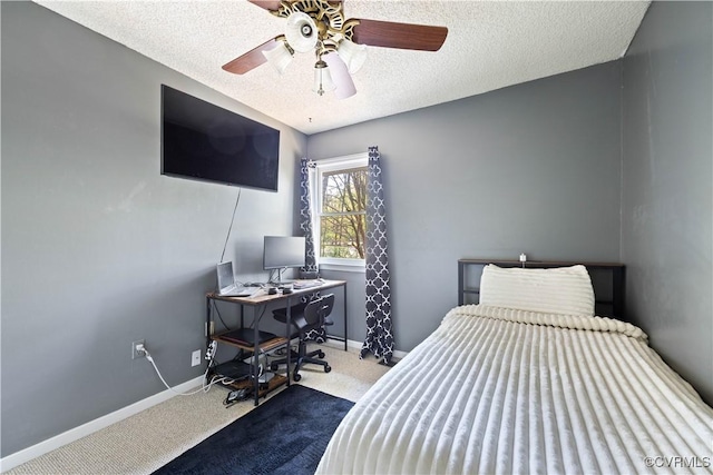 bedroom featuring a textured ceiling, ceiling fan, baseboards, and carpet floors