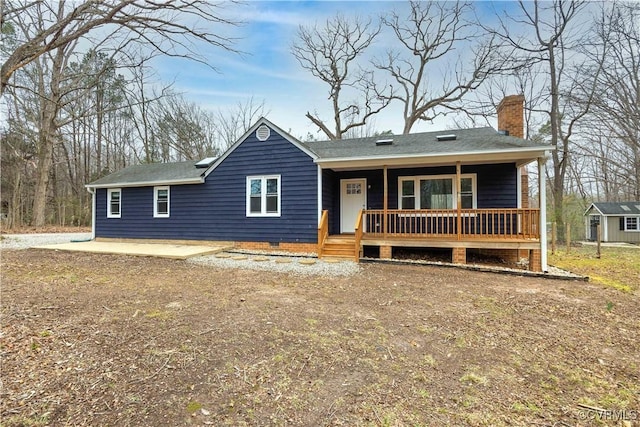 ranch-style house with crawl space, covered porch, and a chimney