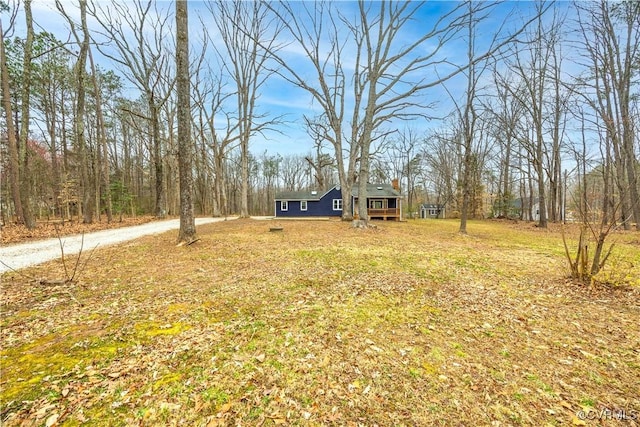 view of front of house featuring a front yard and dirt driveway